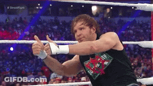 A Wrestler Giving A Thumbs Up In A Ring GIF