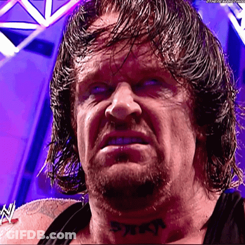 A Wrestler Has A Tattoo On His Neck That Says ' Reign ' GIF