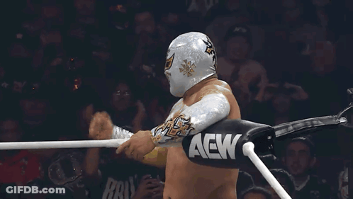 A Wrestler In A Ring With Aew Gloves GIF