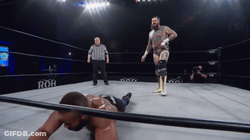 A Wrestler In A Ring With The Word Roh On The Wall GIF