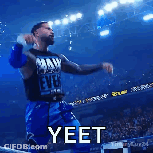 A Wrestler In A Tank Top That Says May Ever Is Dancing In Front Of A Crowd And Says Yeet GIF