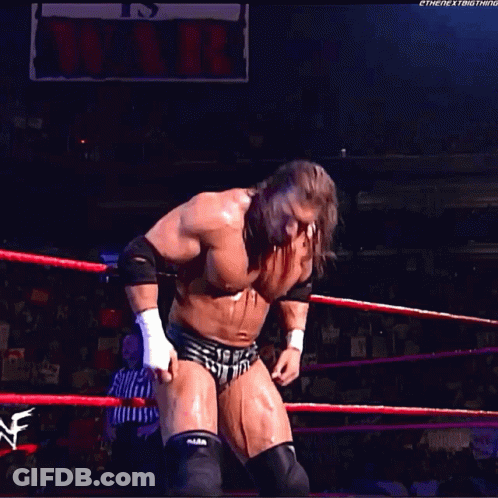 A Wrestler In A Wrestling Ring With A Sign That Says It 'S Over GIF