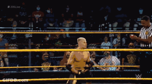 A Wrestler In A Wrestling Ring With The Hashtag # 205Live GIF