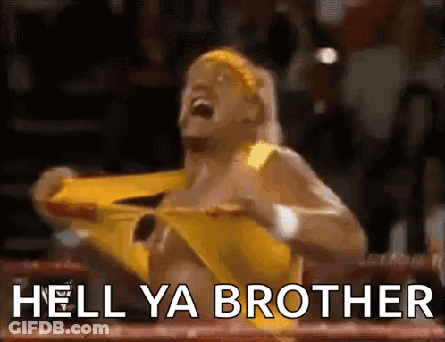 A Wrestler In A Yellow Outfit Is Screaming In A Boxing Ring With The Words Hell Ya Brother Written Below Him . GIF