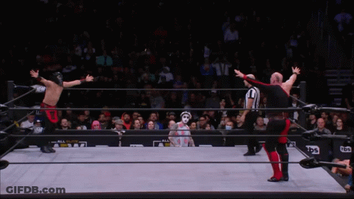 A Wrestler Is Being Lifted By Another Wrestler In A Ring That Says Abw On The Side GIF