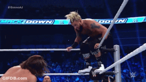 A Wrestler Is Jumping Over A Rope While Another Wrestler Is Watching GIF