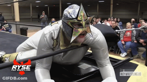 A Wrestler Is Laying On The Floor With A Ryse Pro Wrestling Logo In The Background GIF