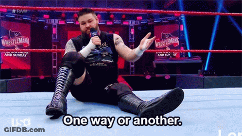 A Wrestler Is Sitting On The Ground In A Wrestling Ring Talking Into A Microphone And Says One Way Or Another GIF