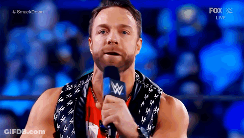 A Wrestler Is Speaking Into A Microphone During A Fox Live Event GIF