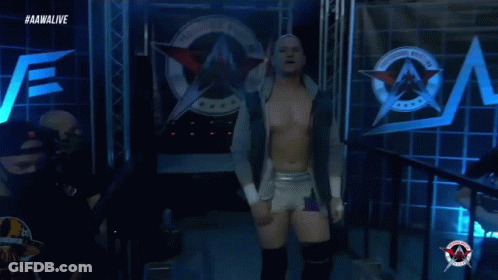 A Wrestler Is Walking Out Of A Ring With The Aawalive Logo In The Background GIF