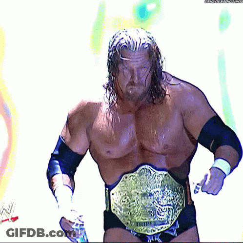 A Wrestler Is Wearing A Belt That Says ' Triple H ' On It GIF