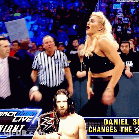 A Wrestler Named Daniel Bryan Is Holding A Wrestling Championship Belt GIF