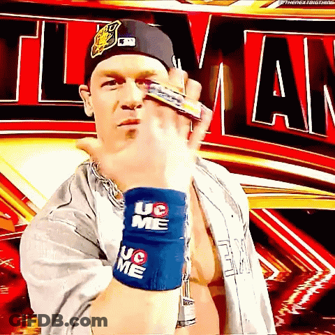 A Wrestler Wearing A Hat And Wristbands That Say Uc On Them GIF