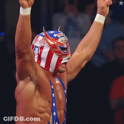A Wrestler Wearing A Mask That Says " America " On It GIF