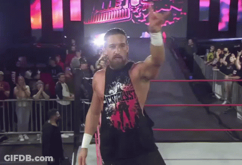 A Wrestler Wearing A Shirt That Says Westminster Stands In A Ring GIF