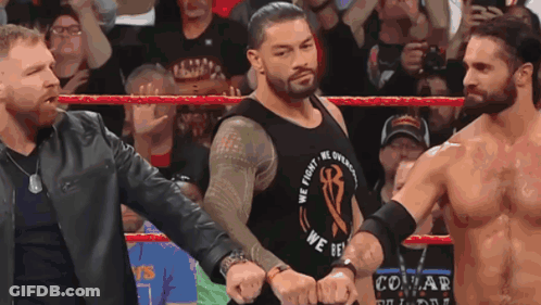 A Wrestler Wearing A We Fight We Overcome Shirt GIF