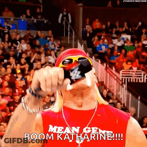 A Wrestler Wearing Sunglasses And A Red Shirt Says Boom Katharine GIF