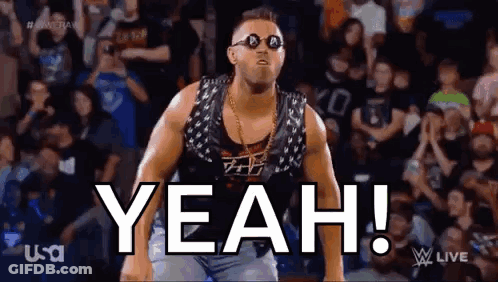 A Wrestler Wearing Sunglasses And A Vest Is Standing In Front Of A Crowd And Says Yeah . GIF