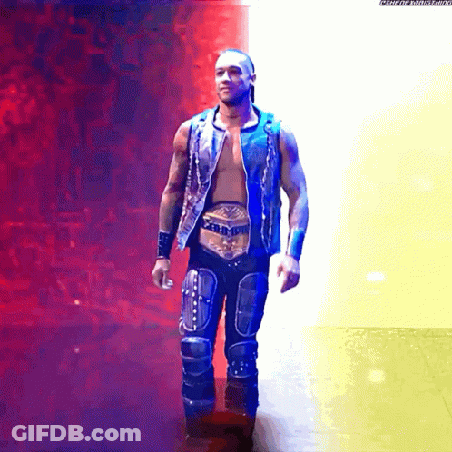 A Wrestler With A Belt That Says ' Intercontinental Heavyweight Champion ' On It GIF