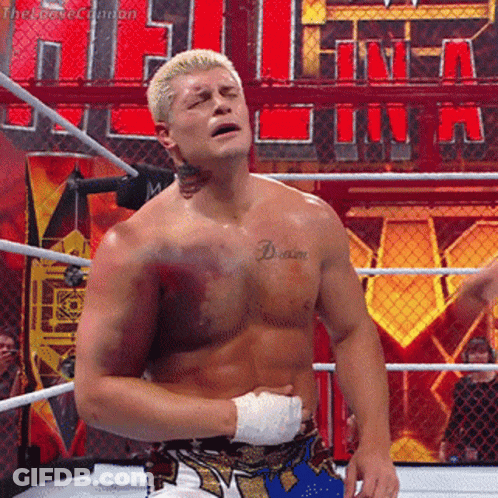 A Wrestler With A Tattoo On His Chest That Says " Dream " GIF