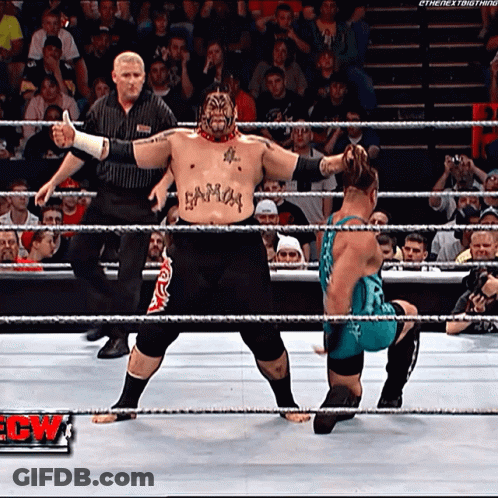 A Wrestler With A Tattoo On His Chest That Says Samoa GIF
