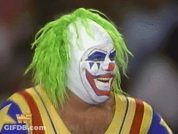 A Wrestler With Green Hair And A Clown Mask GIF