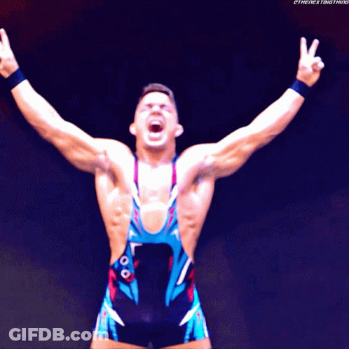A Wrestler With His Arms Outstretched With The Next Thing Written On The Bottom Right GIF