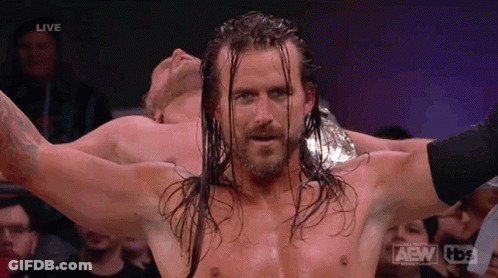 Wrestler With Long Hair And Beard Arms Outstretched GIF