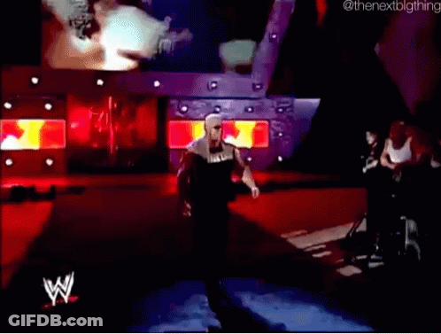A Wrestler With The Word Hulk On His Shirt Walks Down The Ramp GIF