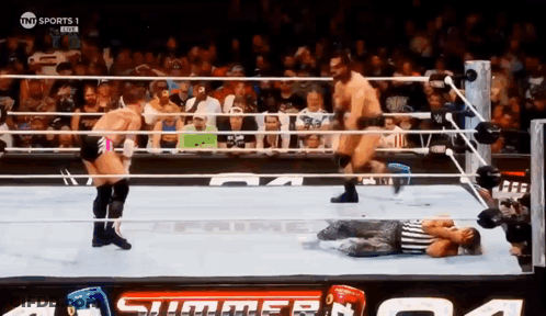 A Wrestling Match Is Being Broadcast On Tnt Sports GIF
