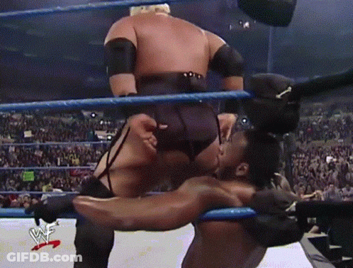 A Wrestling Match Is Being Broadcasted On Wwe Television GIF