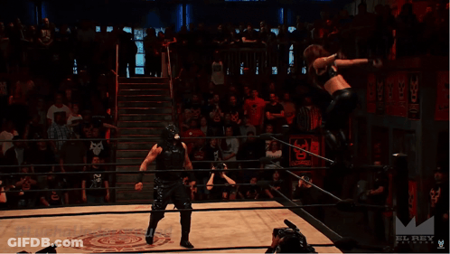 A Wrestling Match Is Being Filmed By A Camera With The Hashtag #Luchaunderground GIF