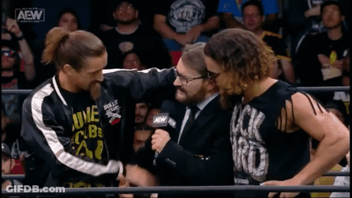 A Wrestling Match Is Being Shown On A Screen With Aew Written On It GIF