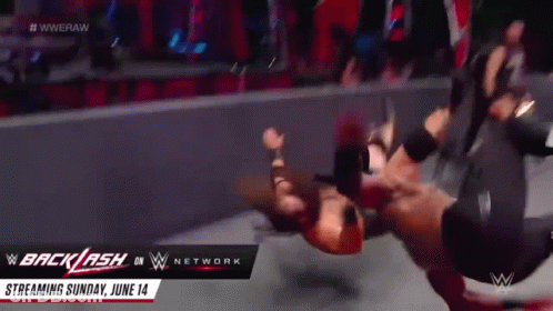 A Wrestling Match Is Being Streamed On The Wwe Network GIF