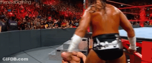 A Wrestling Match Is Going On In Front Of A Crowd And The Words Thenextbigthing Are On The Bottom GIF