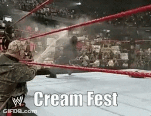 A Wrestling Match Is Taking Place In A Ring With The Words Cream Fest Written On The Bottom GIF