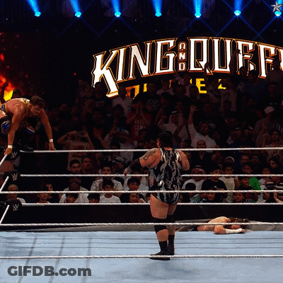 A Wrestling Match Is Taking Place In Front Of A Sign That Says King Of Kings GIF