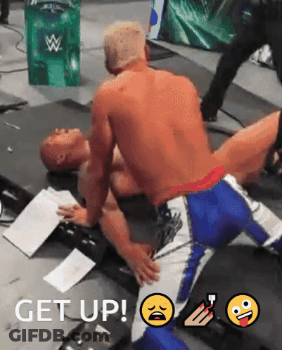 A Wrestling Match With The Words Get Up On The Bottom Of The Image GIF
