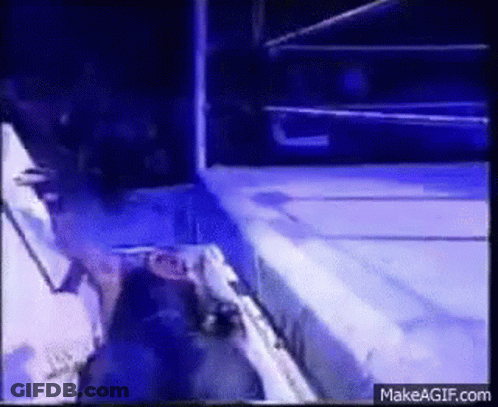 A Wrestling Ring With A Blue Light Coming Out Of It GIF