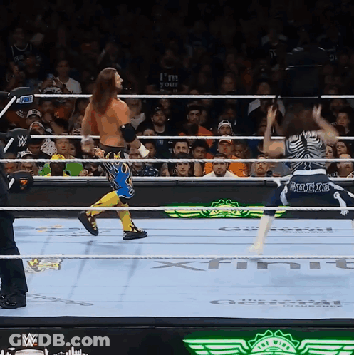 A Wrestling Ring With A Sign That Says ' I 'M Your ' On It GIF