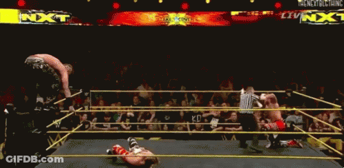 A Wrestling Ring With A Sign That Says Nxt GIF
