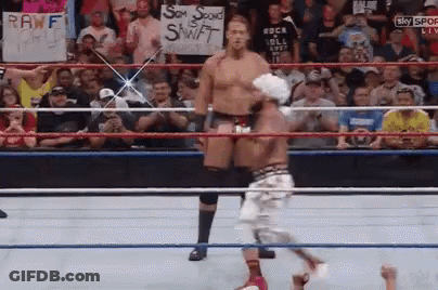 A Wrestling Ring With A Sign That Says Rawf GIF