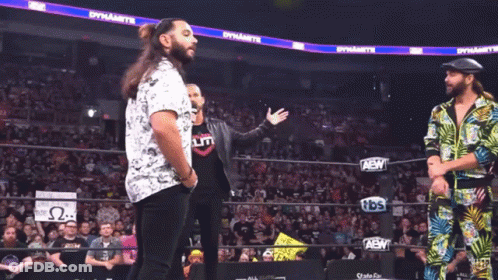 A Wrestling Ring With A Sign That Says We Miss You Kenny On It GIF