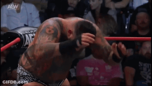 A Wrestling Ring With Aaw Written On The Side GIF