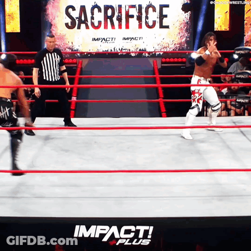 A Wrestling Ring With The Word Sacrifice On The Wall GIF