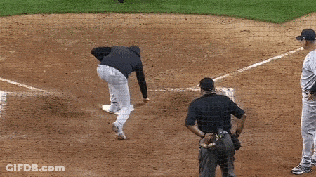 A Yankees Baseball Player Talks To A Referee GIF