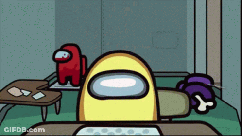 A Yellow Among Us Character Is Sitting At A Table GIF