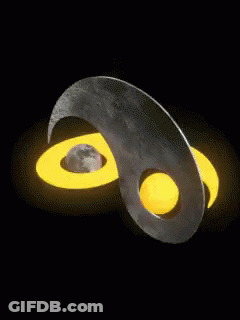 A Yellow And Gray Yin Yang Symbol With A Crescent Moon GIF