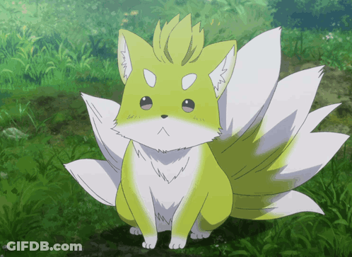 A Yellow And White Fox With A Long Tail GIF