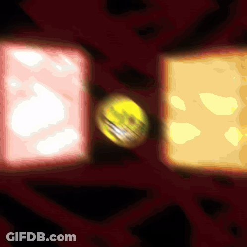 A Yellow Ball Is In The Middle Of A Red Circle GIF